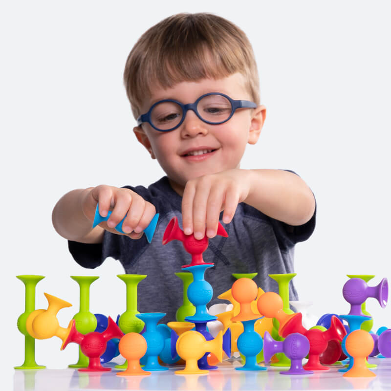 Child having fun playing with Squigz!
