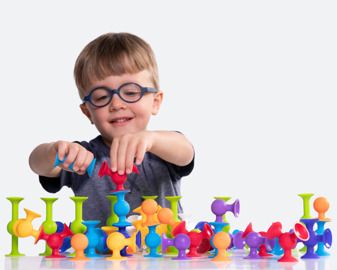 Child having fun playing with Squigz!